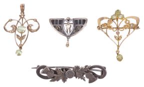 An Arts & Crafts pierced enamelled scroll brooch and two Art Nouveau pendantsthe former set with a