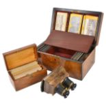 A good 19th century cased stereoscope by Carythe burr walnut veneered stereoscope inset with trade