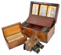 A good 19th century cased stereoscope by Carythe burr walnut veneered stereoscope inset with trade