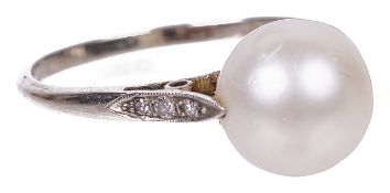 An Edwardian large single pearl set ringthe pearl untested and set in 18ct white gold mount with