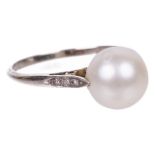 An Edwardian large single pearl set ringthe pearl untested and set in 18ct white gold mount with