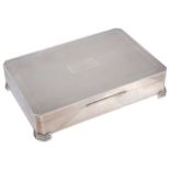 An Art Deco style silver cigarette box, hallmarked Birmingham 1970of canted rectangular form with