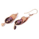 A pair of small Victorian almandine garnet shell scroll earringsthe yellow metal drops of scroll