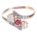 A delicate Edwardian gem and pearl set twist ringthe central red stone between a pearl to either