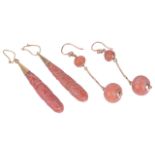 A large pair of antique carved coral drop earrings and another pairthe natural red coral drops