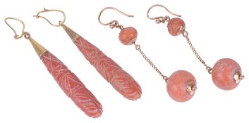 A large pair of antique carved coral drop earrings and another pairthe natural red coral drops