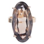 A large gold mounted smokey quartz set dress ringthe facetted oval stone in 9ct gold mount, circa