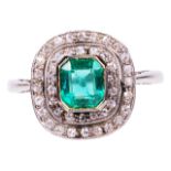 An attractive Art Deco emerald and diamond set cluster ringthe central octagonal emerald, set within