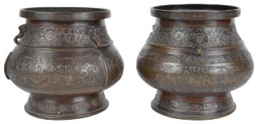 A pair of late 19th century Chinese bronze vases of archaistic formhaving applied elephant masks