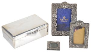 A silver cigarette box hallmarked London 1921of rectangular form with hinged cover with sectioned