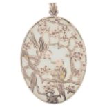 A Continental Chinese oval jade and gold overlay 'lovebirds' pendant,the polished pale celadon