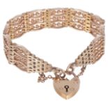 A fancy gold four bar gate bracelet with heart padlock fasteningthe bracelet of substantial