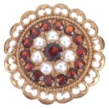 A gold mounted garnet and pearl set cluster broochthe circular brooch having central garnet within a