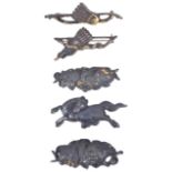 A collection of five Japanese bronze menukeone of a prancing horse with gold detail and with