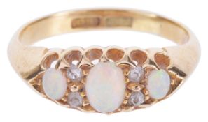 A delicate three stone precious opal and diamond set ring,having central oval opal of good colour