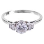 An attractive diamond and baguette diamond set ringthe central stone approximately 0.65ct. and set