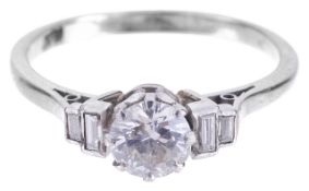 An attractive diamond and baguette diamond set ringthe central stone approximately 0.65ct. and set