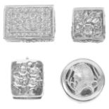 Three Contemporary silver pill boxes, 20th centurytwo embossed with flower heads and the other