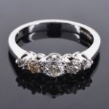 An antique style five stone diamond set ringthe central stone approximately 0.20 ct and with two