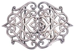 A late Victorian two piece silver scroll buckle, Birmingham 1900of stylised pierced heart design,