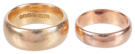 A large and heavy Edwardian 18ct gold gentleman's wedding band and anotherthe former wedding band