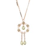 A charming Edwardian peridot and pearl drop pendant on chainthe circular pendant set with five