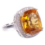 A large striking contemporary citrine and diamond set fancy ringthe central cushion cut citrine