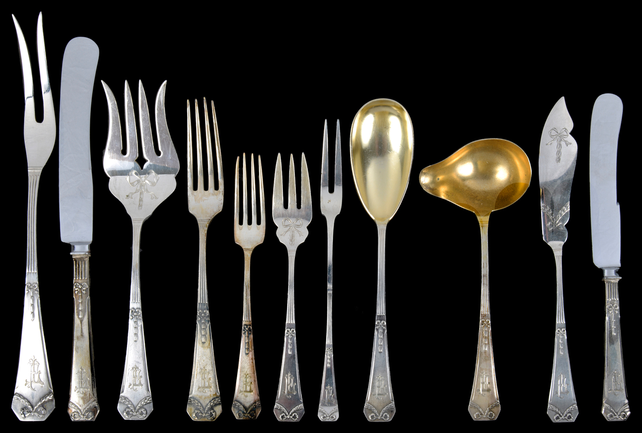 A suite of German silver flatware, early 20th centurynine table forks and nine table knives; nine