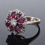 A large Continental ruby and diamond set fancy floral cluster ring, circa 1960,having central