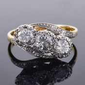 A three stone diamond set twist ringeach diamond approximately 0.25 ct. and set in an 18ct gold