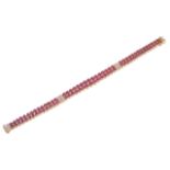 An elegant Continental twin row ruby and diamond articulated strap braceletthe pairs of rubies