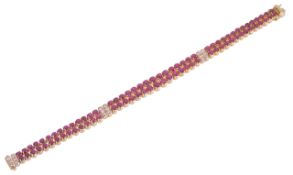 An elegant Continental twin row ruby and diamond articulated strap braceletthe pairs of rubies