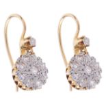A pair of delicate Edwardian diamond set cluster drop earringsthe cluster drops suspended from the