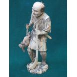 GOOD QUALITY HEAVILY CARVED SECTIONAL IVORY FIGURE DEPICTING AN ORIENTAL HUNTSMAN, SIGNED TO BASE,