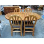 MODERN CIRCULAR PINE EXTENDING DINING TABLE WITH THREE LEAVES AND FIVE CHAIRS