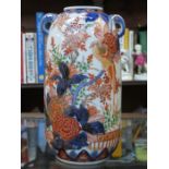 ORIENTAL HANDPAINTED AND GILDED TWO HANDLED CERAMIC VASE IN THE IMARI PALETTE