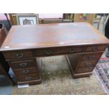 MAHOGANY SEVEN DRAWER LEATHER TOPPED WRITING DESK