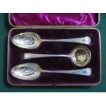 CASED PAIR OF EARLY HALLMARKED SILVER DECORATIVE SPOONS WITH MATCHING STRAINING LADLE,