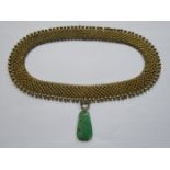 UNHALLMARKED GOLD COLOURED NECKLACE WITH CARVED ORIENTAL STYLE JADE DROPLET
