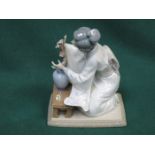 LLADRO GLAZED CERAMIC FIGURE OF A KNEELING GEISHA WITH FLOWERS,