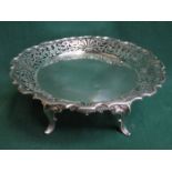 WALKER & HALL HALLMARKED SILVER WAVE EDGED PIERCEWORK DECORATED CAKE STAND ON RAISED SUPPORTS,