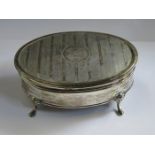 HALLMARKED SILVER OVAL JEWELLERY BOX ON RAISED SUPPORTS WITH MACHINE TURNED HINGED COVER (AT FAULT)