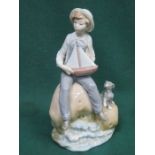 LLADRO GLAZED CERAMIC FIGURE OF A BOY WITH DOG AND MODEL YACHT,