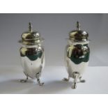 PAIR OF HALLMARKED SILVER SHAKERS ON RAISED SUPPORTS,