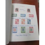 FOUR ALBUMS OF VARIOUS FOREIGN POSTAGE STAMPS