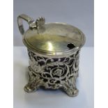 HALLMARKED SILVER PIERCEWORK DECORATED MUSTARD POT WITH HINGED COVER AND BLUE GLASS LINER,