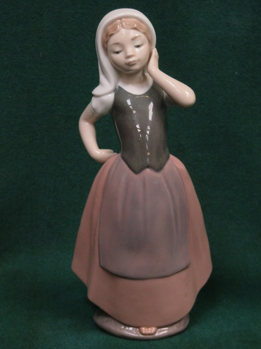 NAO GLAZED CERAMIC FIGURE,