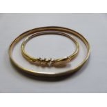 GOLD COLOURED SNAKE FORM BANGLE AND ROLLED GOLD BANGLE