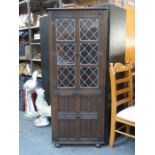 OAK TWO DOOR LEADED GLASS CORNER CUPBOARD