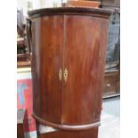 ANTIQUE MAHOGANY BOW FRONTED CORNER CUPBOARD